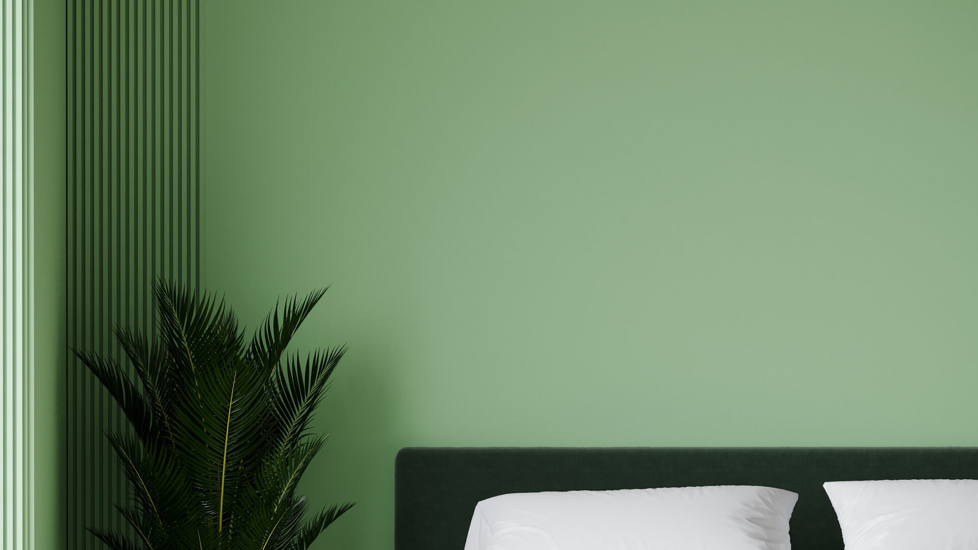 Chambre d'hôtel avec un mur vert, un lit blanc et une plante.